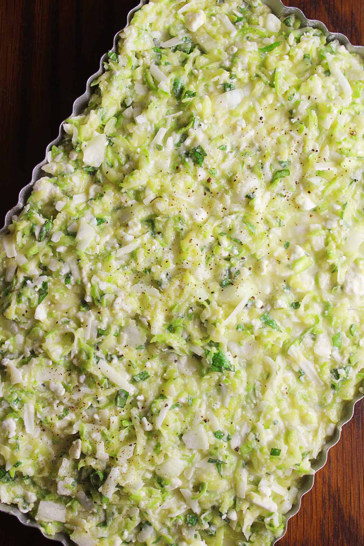 Greek zucchini pie in a baking dish before baking.