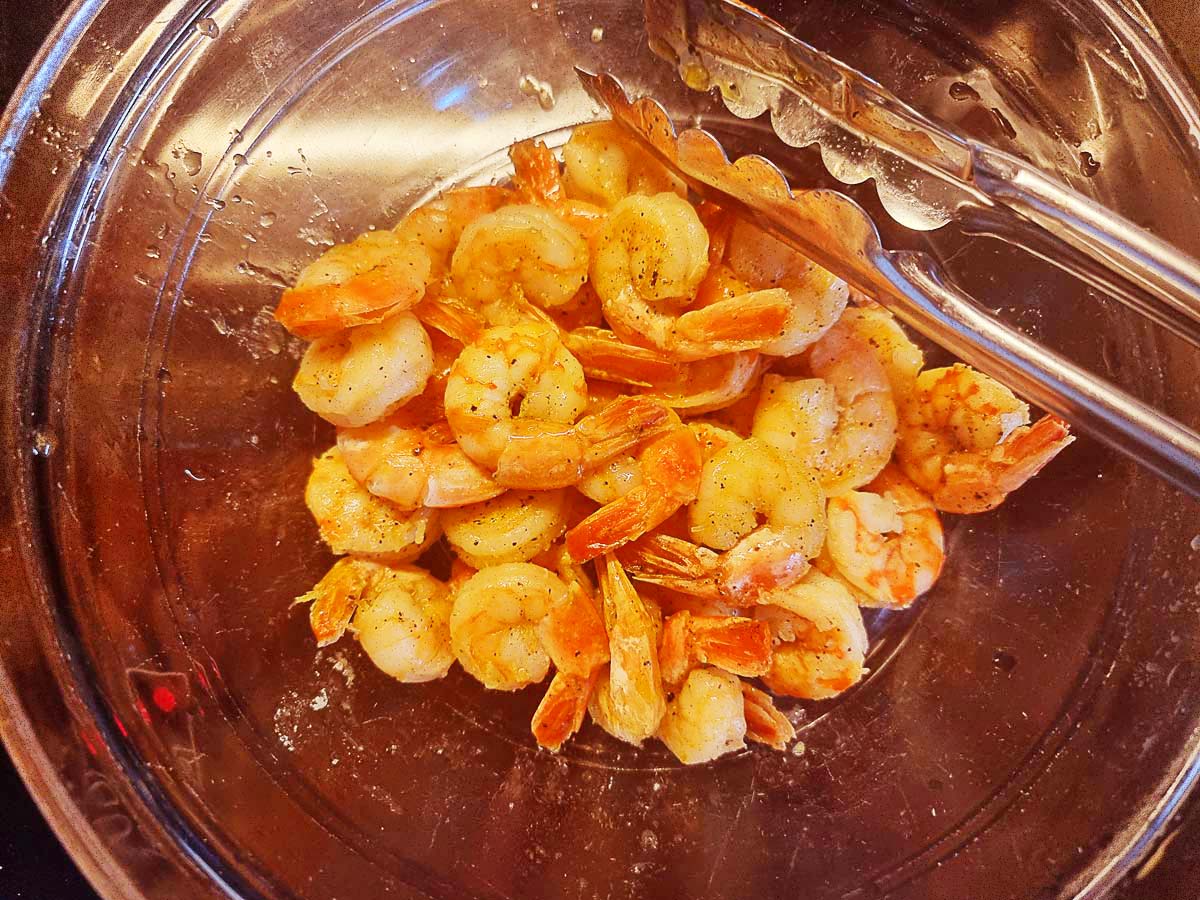 A glass bowl with shrimps.