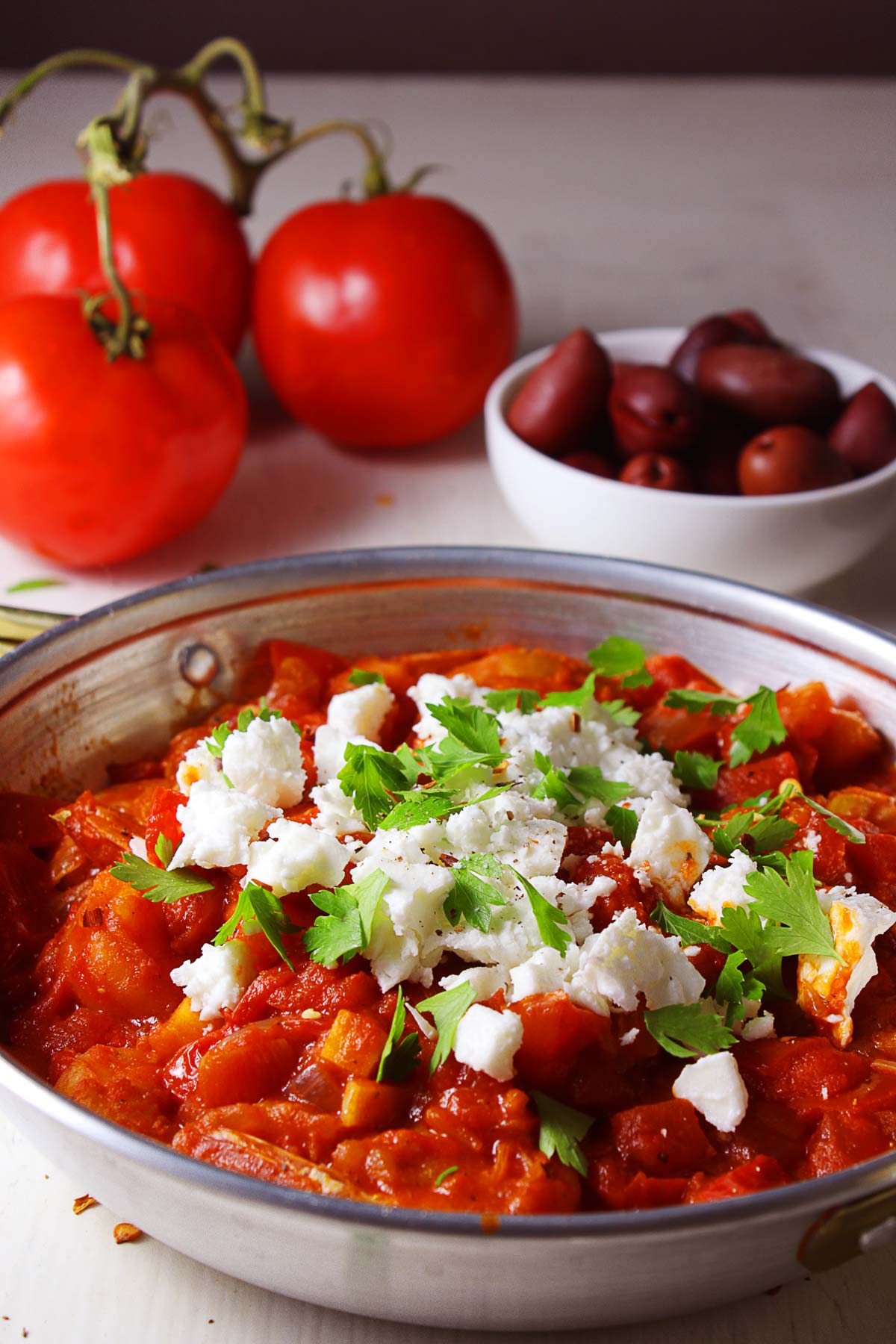 A close up photo with Greek shrimp saganaki.