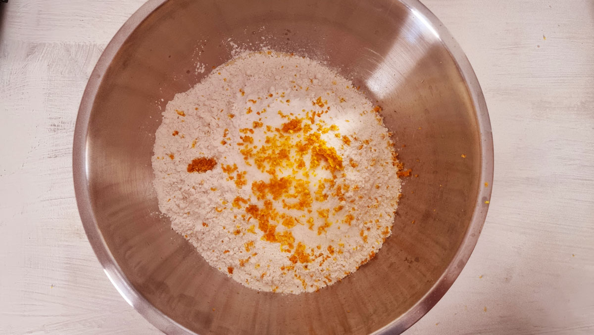 A mixing bowl with dry ingredients to make a Greek revani.