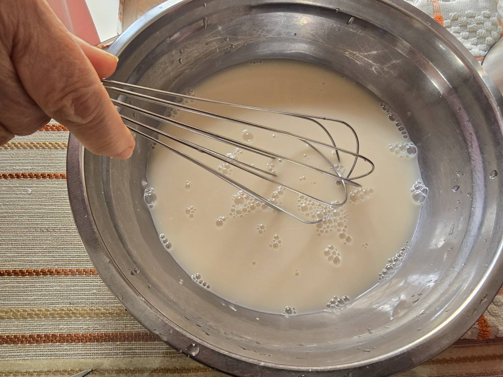 Activating the yeast for making Greek donuts (loukoumades).