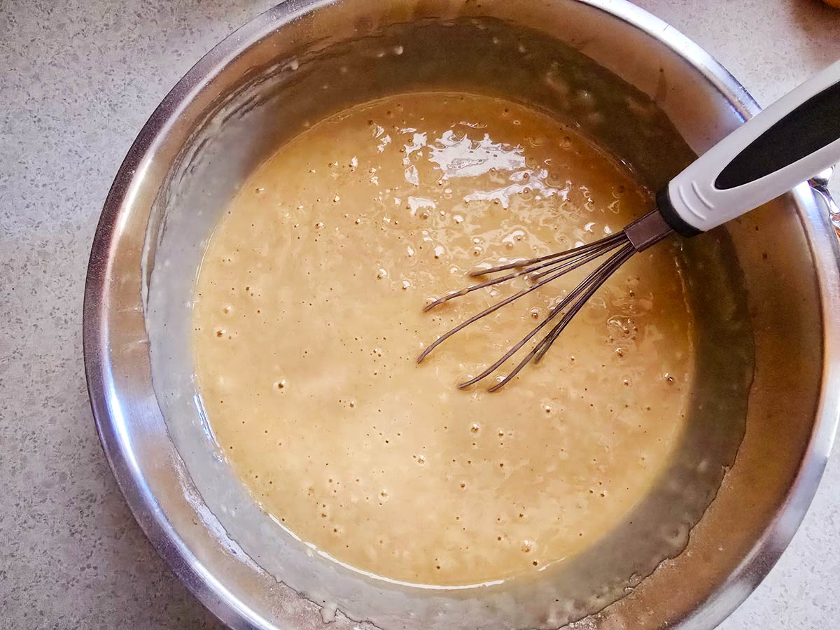 A bowl with the final batter for Greek vegan cake.